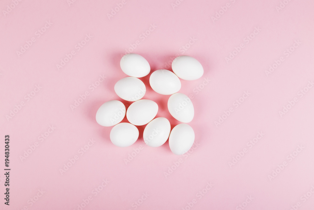 White egg on pink background. Top view White egg on pink background. Top view