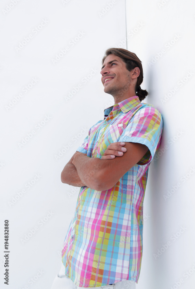 modern guy leaning on wall and looking forward. modern guy leaning on wall and looking forward.