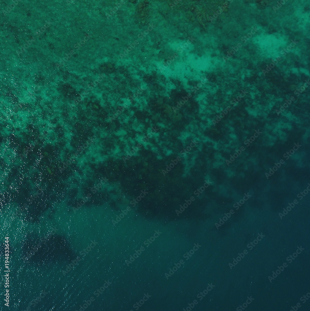 Aerial top drone view of transparent sea water surface