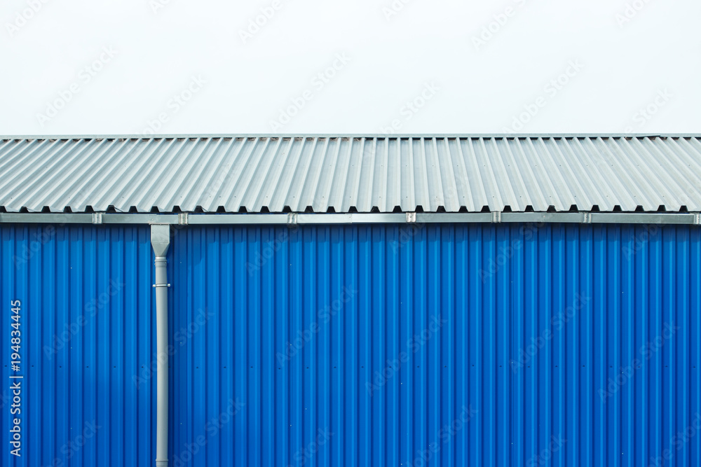 Industrial building blue sheet metal facade, abstract background Industrial building blue sheet metal facade, abstract background