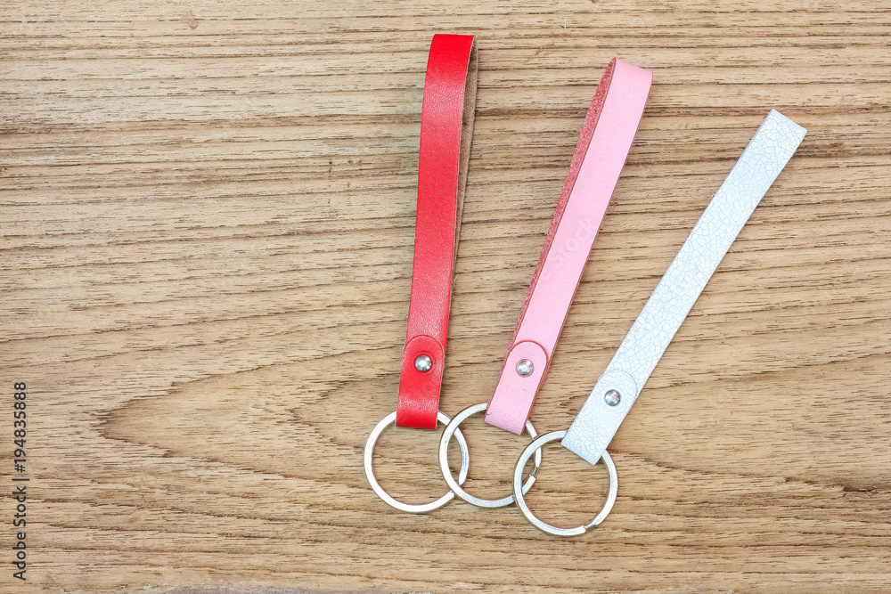 Collection set of colorful Leather key chain on wooden background. Collection set of colorful Leather key chain on wooden background.