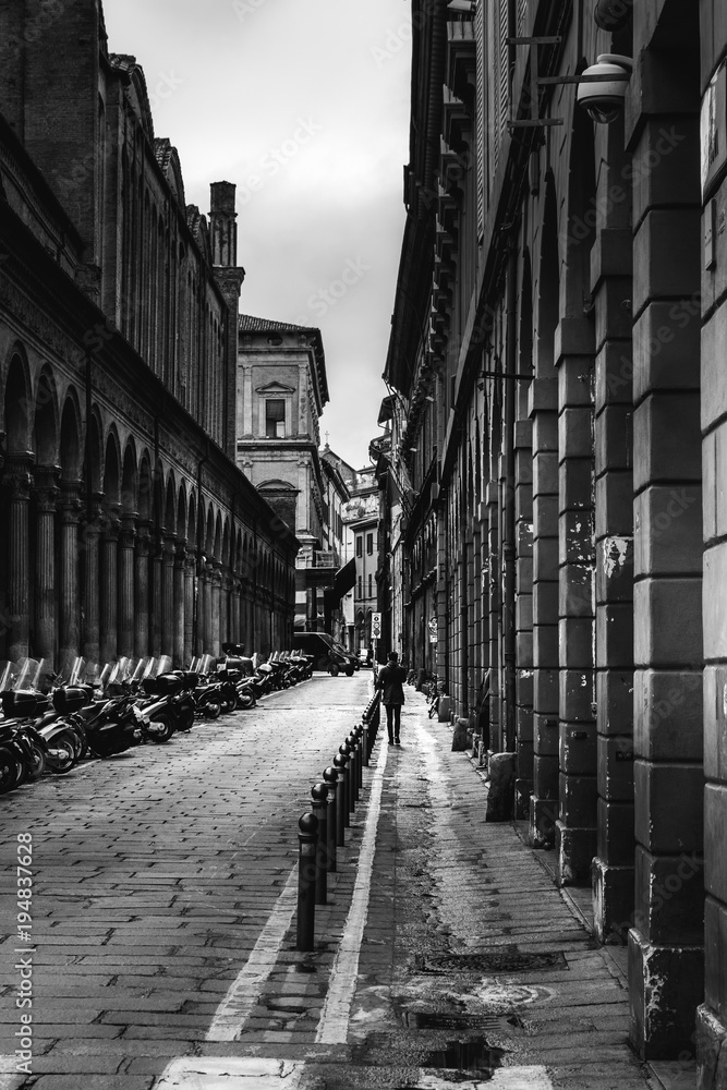 Black and white image of a street in Bologna, Italy