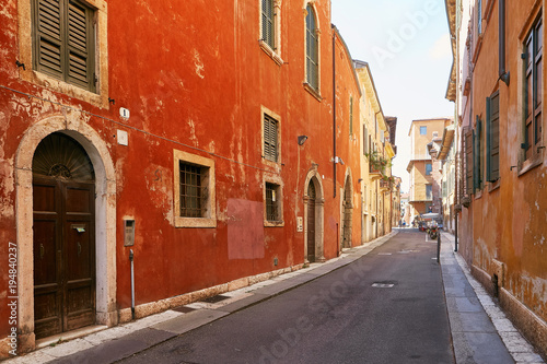 VERONA, ITALY - AUGUST 17, 2017: Narrow street of Verona high vibrant building facades. © makam1969