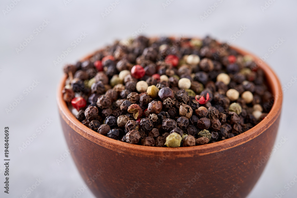 Seasoning - four kinds of pepper peas - isolated on white background Seasoning - four kinds of pepper peas - isolated on white background
