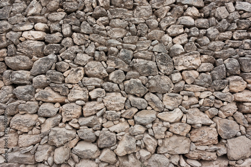 wall of rough cobblestones in a row