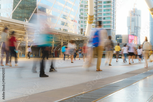 People walking in motion blur in the city