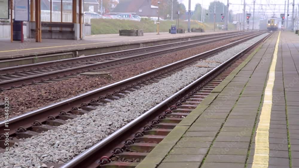 train entering railway station and stops. Doors open train entering railway station and stops. Doors open