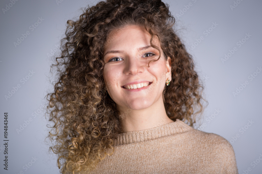  woman with curly hair, studio.