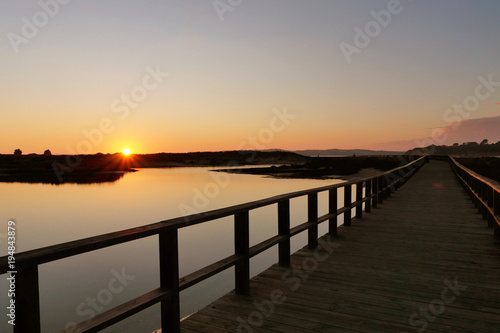 Alvor  Algarve  wooden trail in sunset in a natural wetland  ribeira do odiaxere