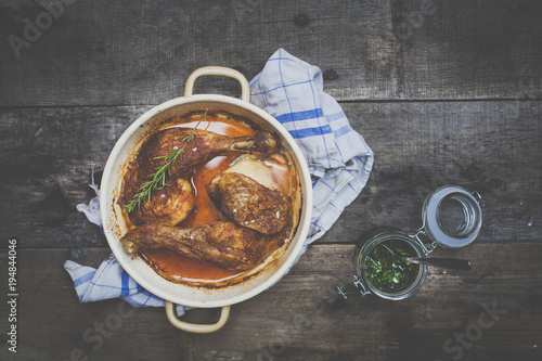 roast chicken with pesto on wooden background photo