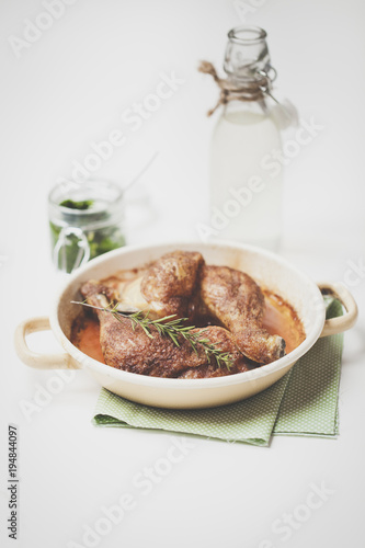 roast chicken with pesto on wooden background
