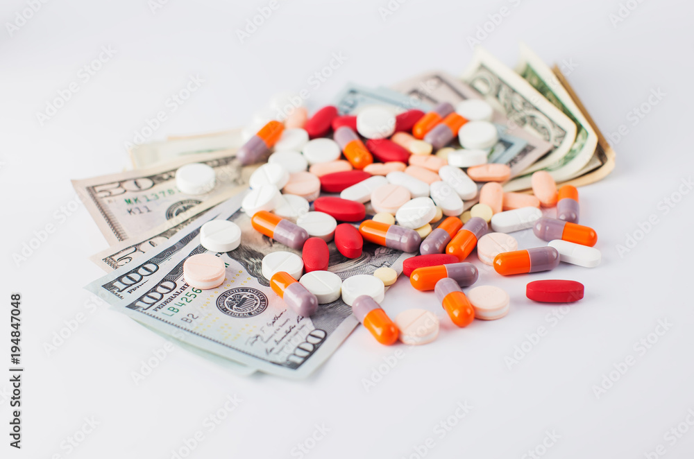 money and pills isolated on white money and pills isolated on white