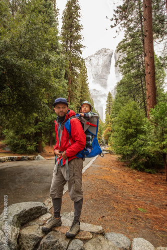 A father with baby son visit Yosemite National Park in Californai, USA photo