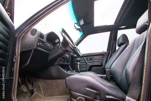 Black leather front seats of retro car