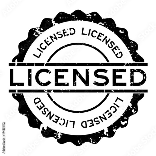 Grunge black licensed word round rubber seal stamp on white background