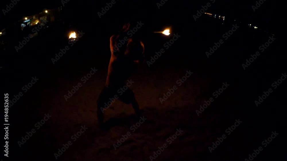 Man Performing A Dance With Fire On Beach Man Performing A Dance With Fire On Beach