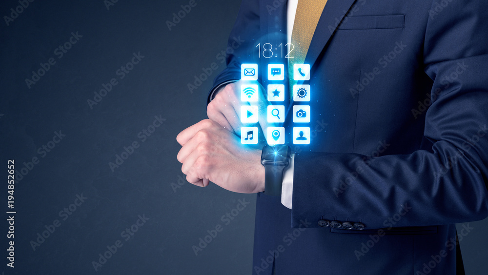 Businessman wearing smartwatch. Businessman wearing smartwatch.