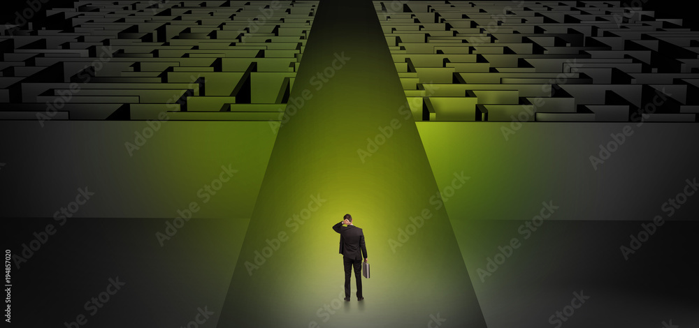 Businessman going straight on two dark mazes Businessman going straight on two dark mazes