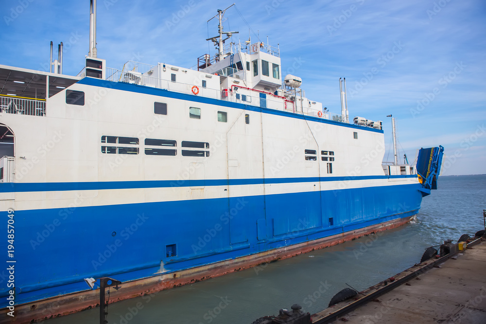 Naklejka premium Modern ferry on the dock. Side view.