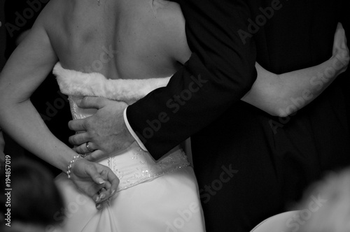 BRIDE AND GROOM ARM IN ARM