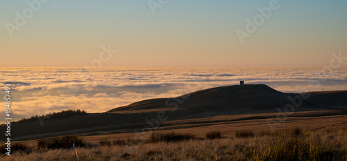Rivington Pike stands above clouds 
