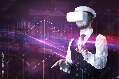 Man standing with VR goggles and graphs charts