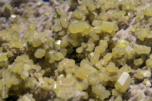 Aragonite rock with yellow sulfur photo