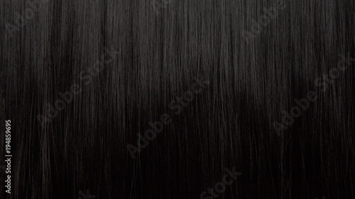 Hair texture background  no person. Black shiny hair comb texturte