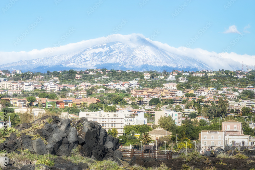 Catania city in Sicily with the Etna volcano on the background. Sicily. Italy.