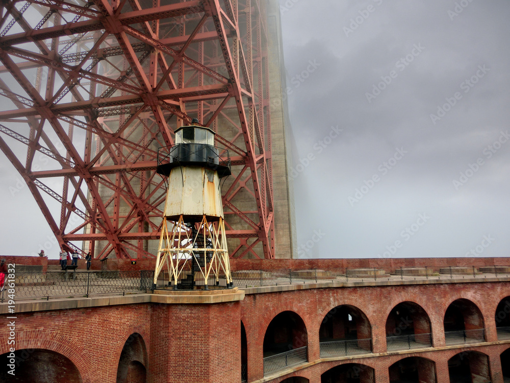 Golden Gate Bridge Fort Point lighthouse San Francisco in the fog