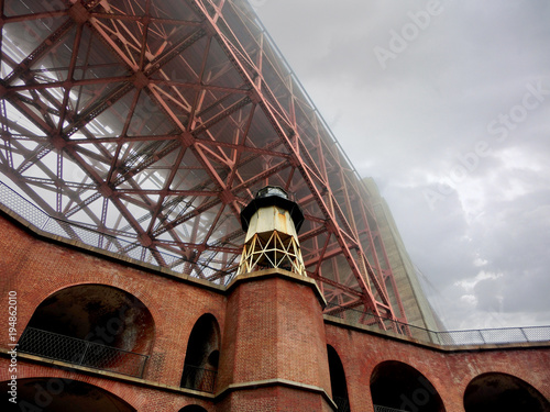 Golden Gate Bridge Fort Point lighthouse San Francisco in the fog