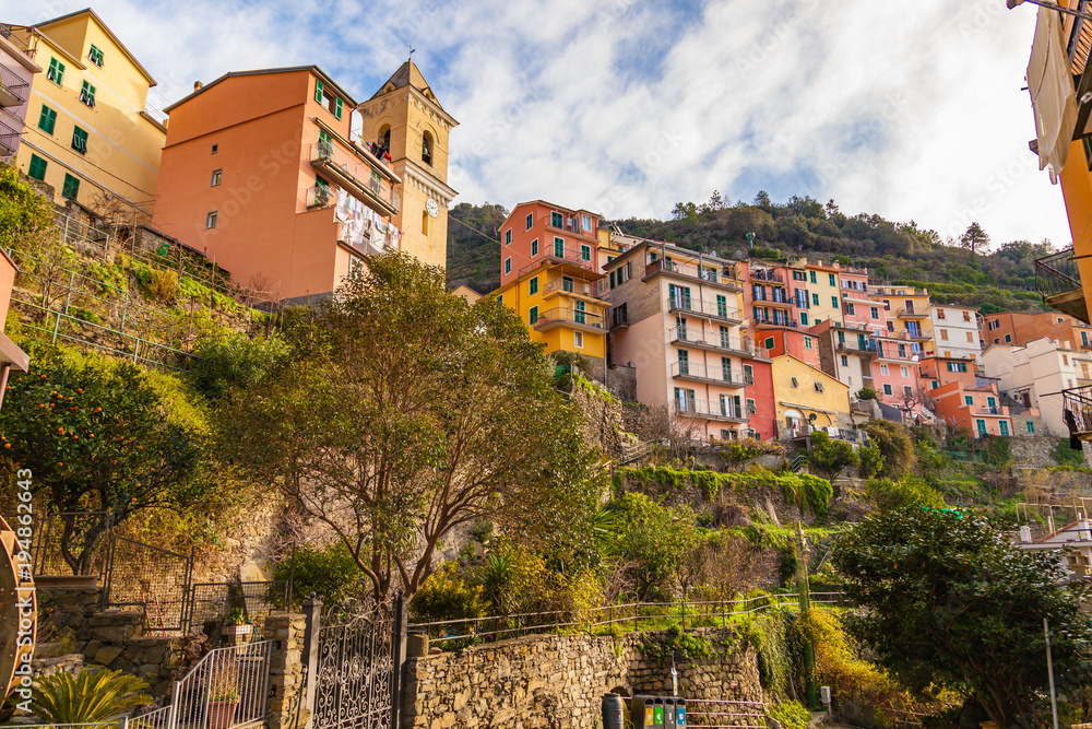 View of the colorful houses along the main street in Manarola. Manarola is one of the five famous villages in Cinque Terre National Park. Liguria, Italy