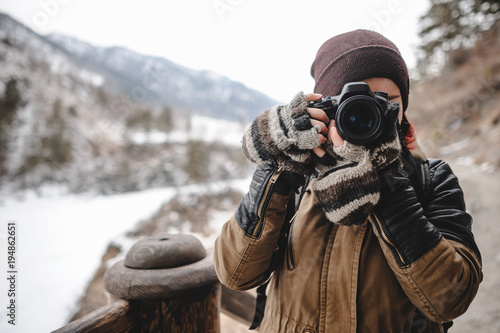 Portrait of photographer taking pictures with digital camera outdoor photo