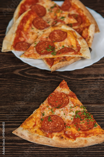 Pepperoni pizza on wooden t...
