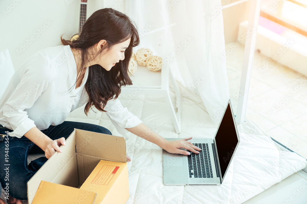 Young asian girl is freelancer with her private business at home office, working with laptop, coffee, online marketing. Young woman startup her SME business. Young asian girl is freelancer with her private business at home office, working with laptop, coffee, online marketing. Young woman startup her SME business.