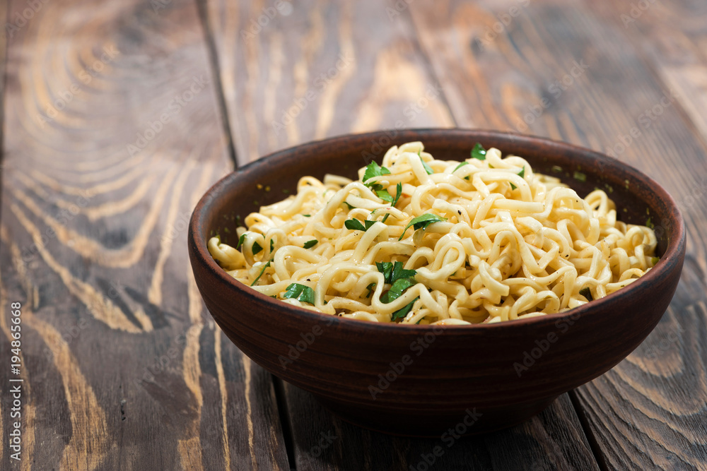 bowl of traditional Chinese noodles on wooden background bowl of traditional Chinese noodles on wooden background