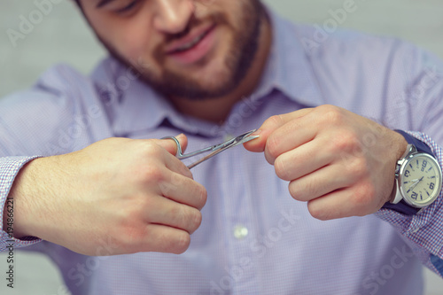 young man polishing his nails