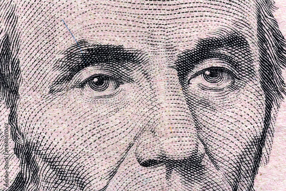fragment of a banknote five American dollars
