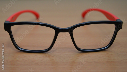 plastic glasses for poor vision is an optical device on the table on the table