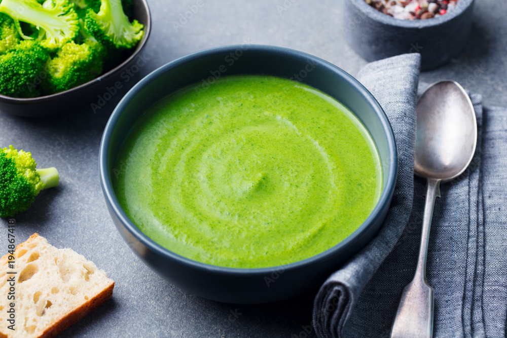 Broccoli cream soup in a bowl with toasted bread. Broccoli cream soup in a bowl with toasted bread.