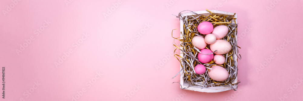 Eggs in a white tray. Creative Easter concept. Modern solid pink background. Eggs in a white tray. Creative Easter concept. Modern solid pink background.