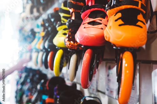 Fotografie Assortment roller skates isolated in store shop, choosing and buy color roller-s