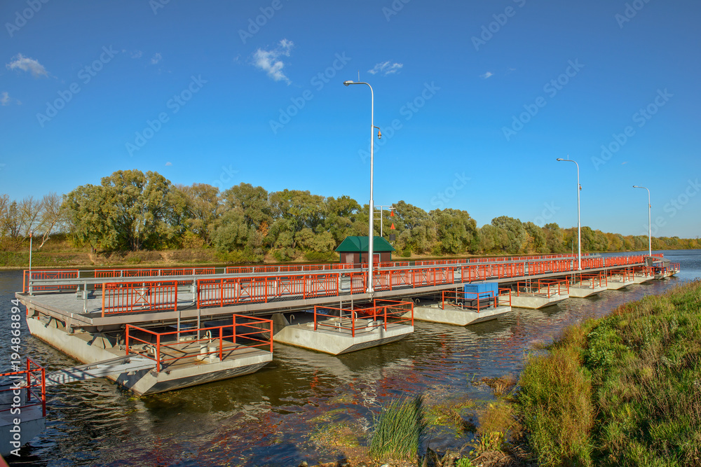 Movable floating bridge