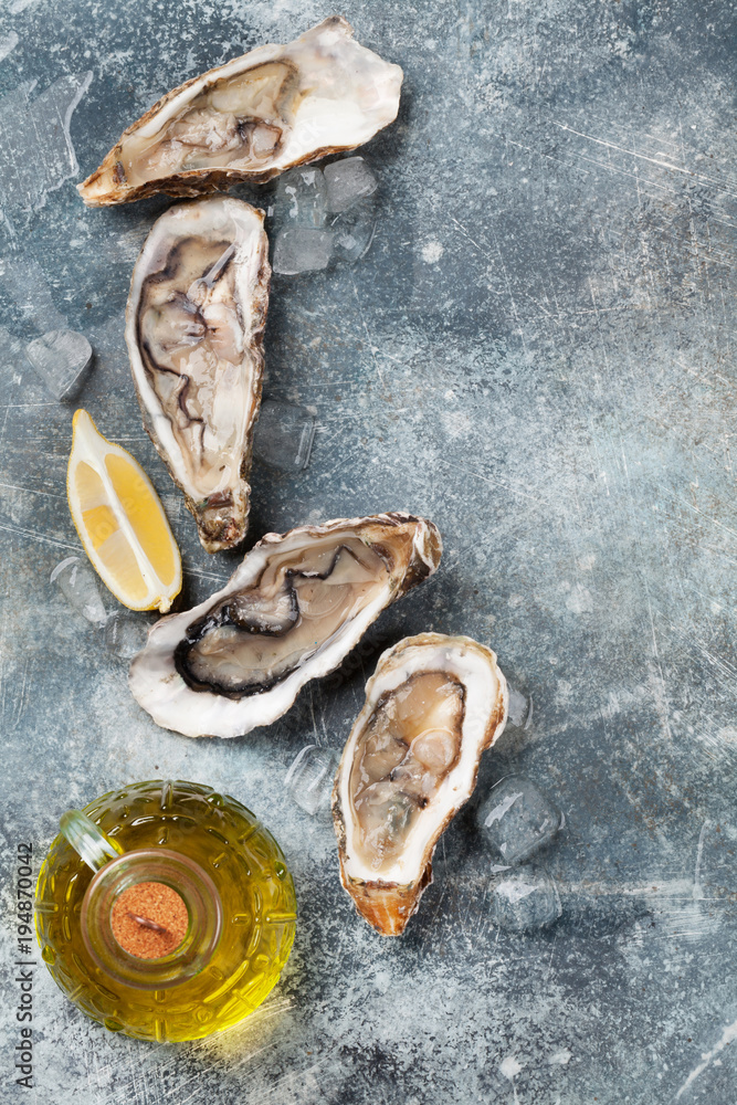 Fresh oysters on stone table Fresh oysters on stone table