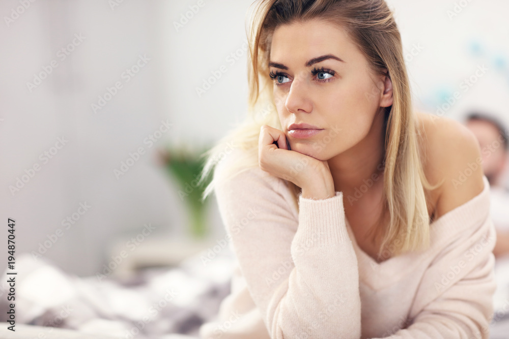Adult attractive couple in bed having problem Adult attractive couple in bed having problem