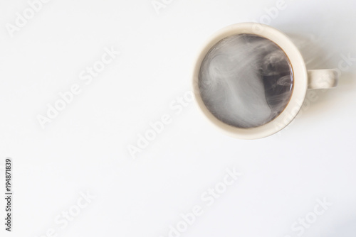  coffee with smoke ready to drink on a white background. View fr
