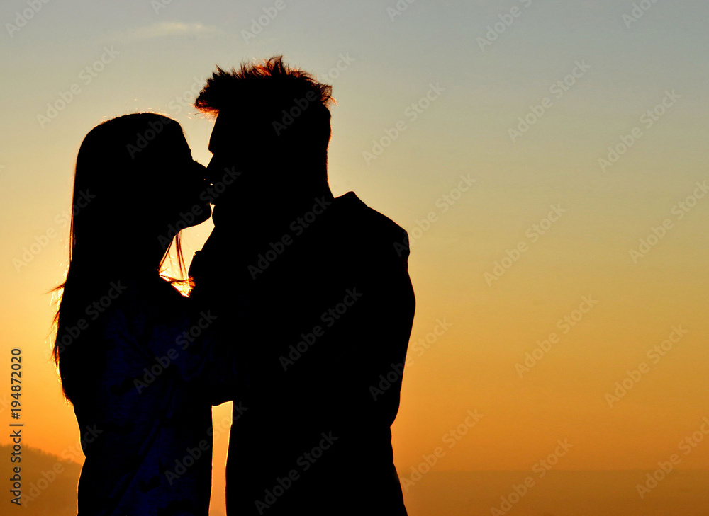 Kiss at sunset.