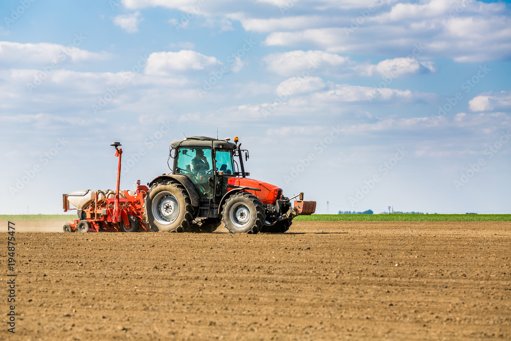 Farmer seeding, sowing crops at field. Sowing is the process of planting seeds in the ground as part of the early spring time agricultural activities. Farmer seeding, sowing crops at field. Sowing is the process of planting seeds in the ground as part of the early spring time agricultural activities.