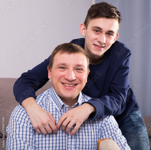 Obraz na płótnie Man with his adult son are posing together