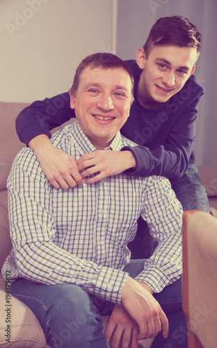 Portrait of guy with his father who are resting together